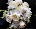 White Dendrobium Orchids, Tulips, Roses and larkspur create this beautiful Bouquet